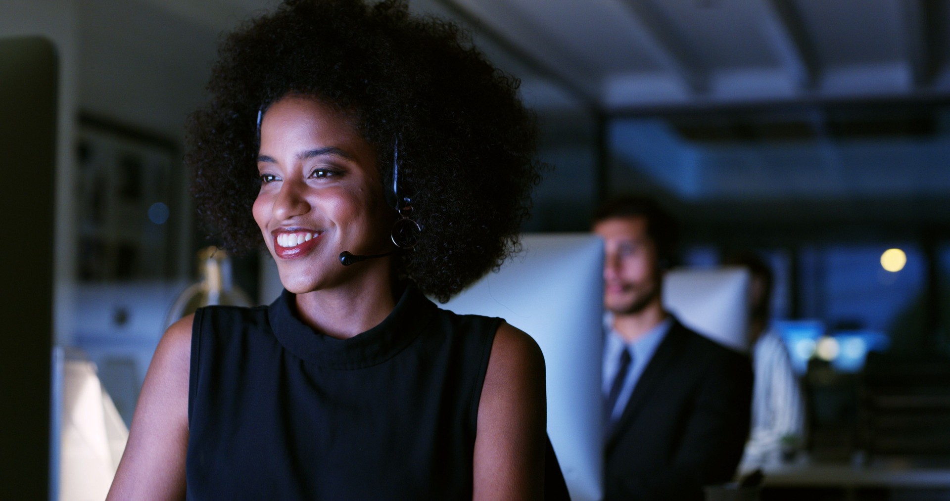 Overtime, help or businesswoman in call center with computer, communication or sales in night. Virtual assistant, consultant or customer service agent with mic headset, online support or loan advice